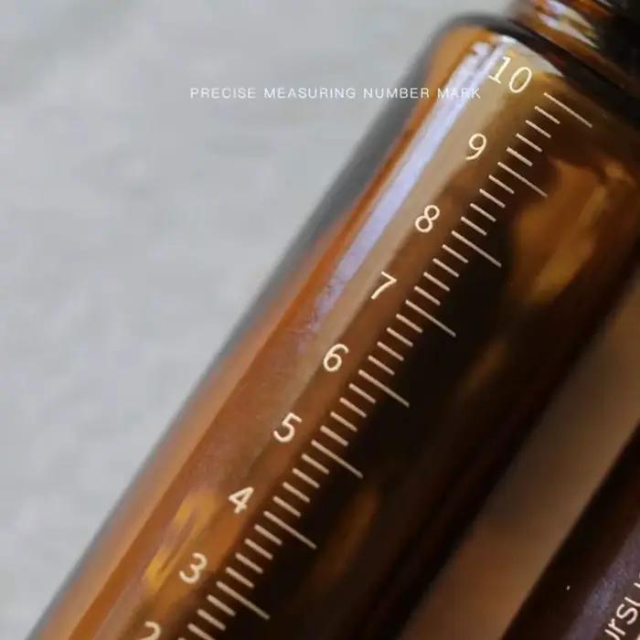 Bouteille d'huile essentielle en verre optique ambré