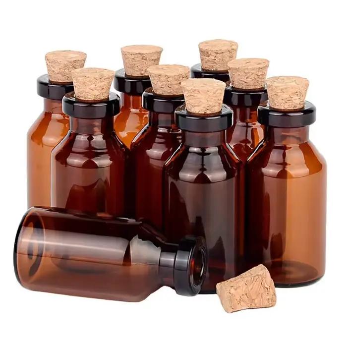 Petites bouteilles en verre ambré avec bouchons en liège