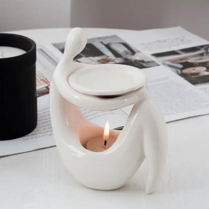 Brûleur d'huiles aromatiques en céramique en forme de corps humain