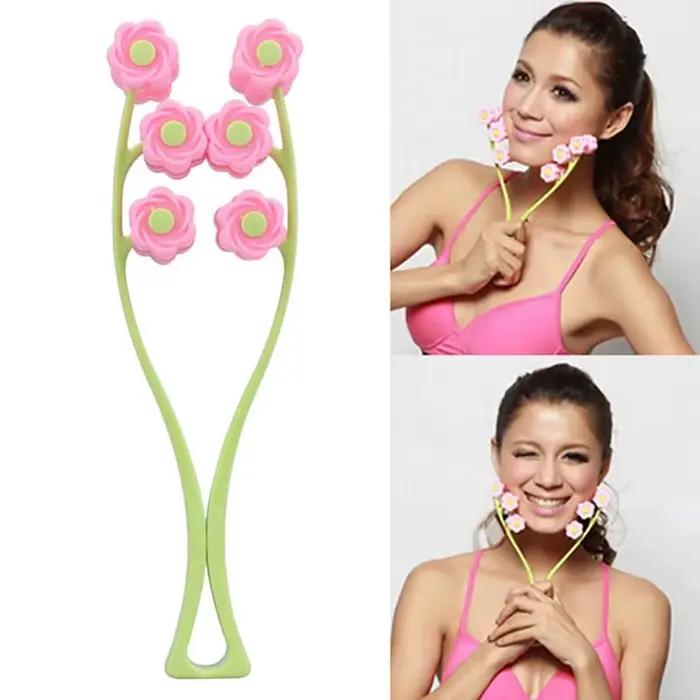 Rouleau de massage facial portable en forme de fleur