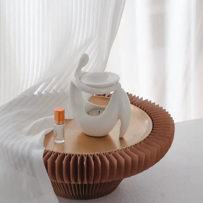 Brûleur d'huiles aromatiques en céramique en forme de corps humain