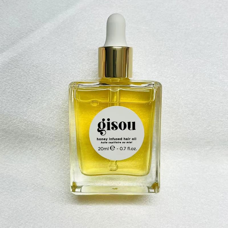 Nouvelle huile capillaire infusée au miel Gisou améliore les soins des cheveux secs, flexibilité ess