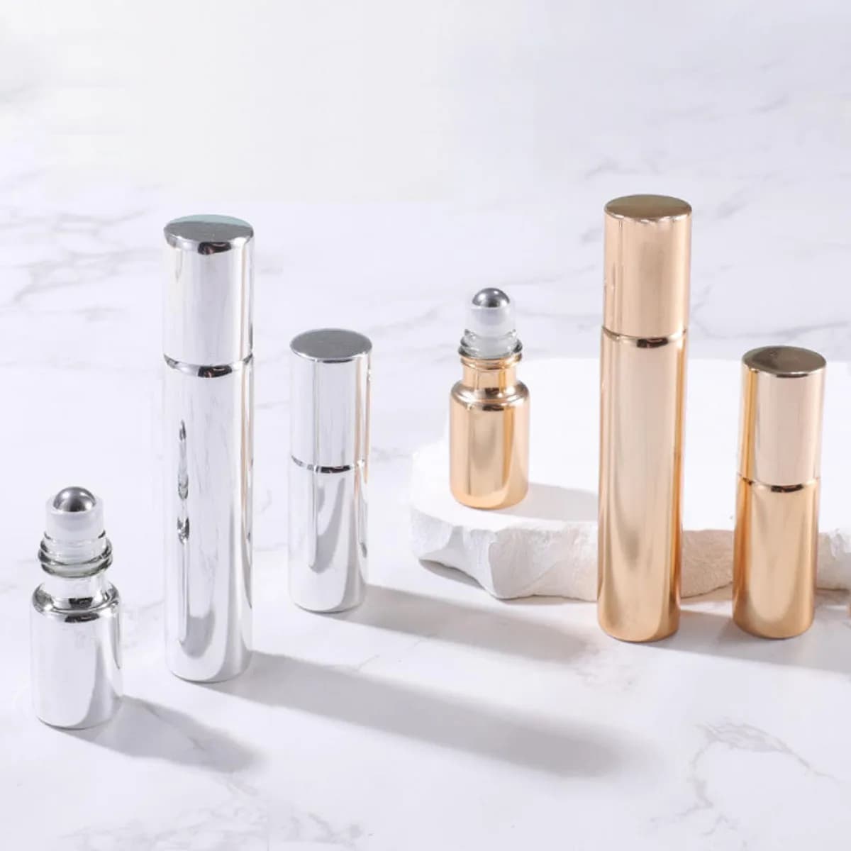 Bouteilles à roulettes en verre or/argent