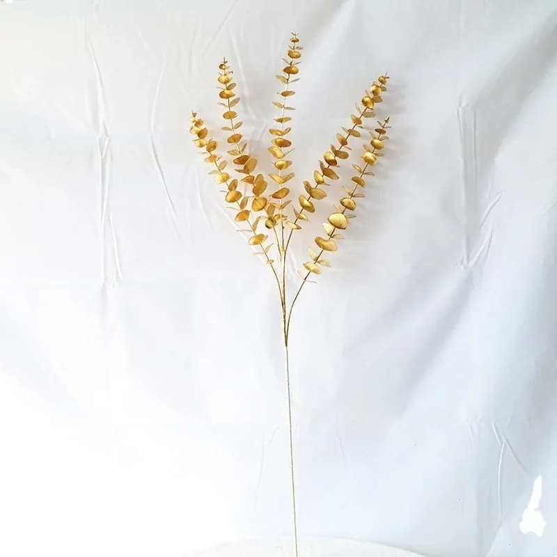 Plantes artificielles dorées chaudes