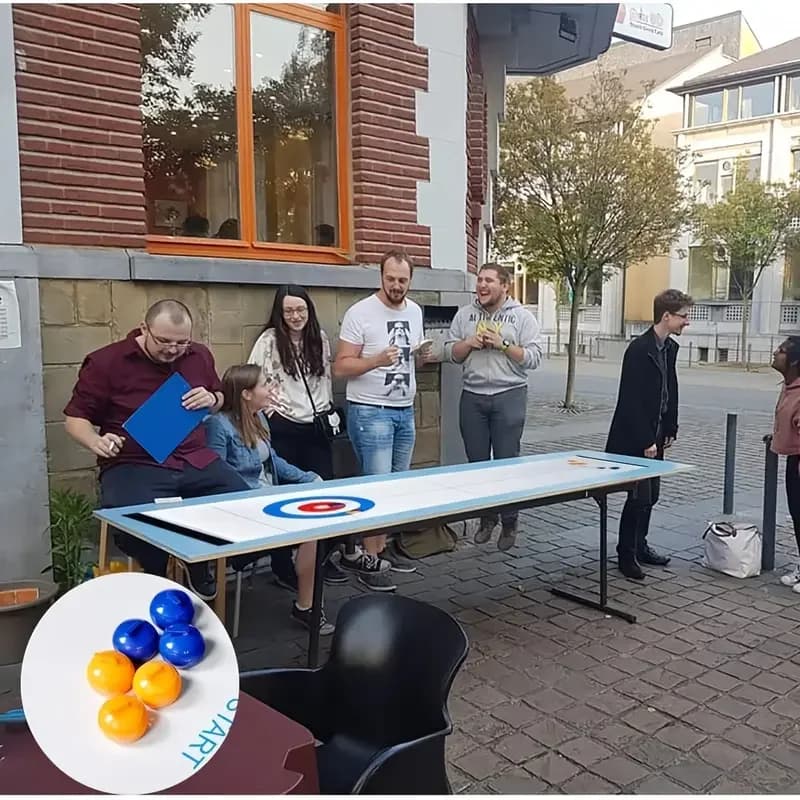 Le jeu de curling de table convient aux adolescents ou aux adultes