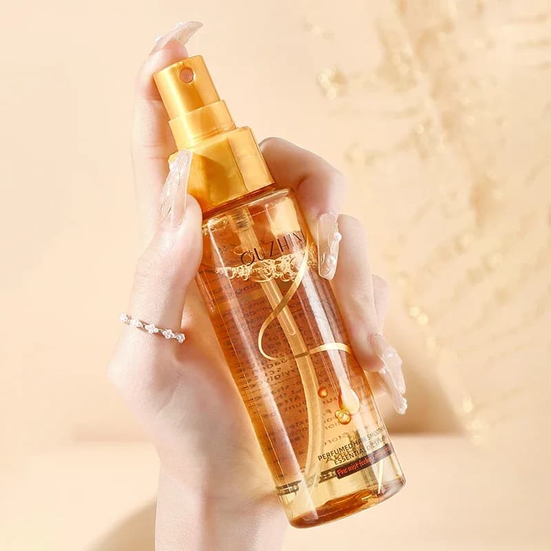 Le spray d'huile essentielle de soin capillaire nourrissant en profondeur peut augmenter la brillance et améliorer la réparation et les dommages aux cheveux Spray de parfum frais