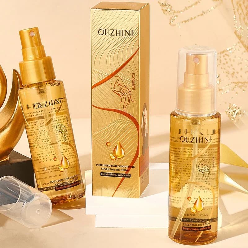 Le spray d'huile essentielle de soin capillaire nourrissant en profondeur peut augmenter la brillance et améliorer la réparation et les dommages aux cheveux Spray de parfum frais