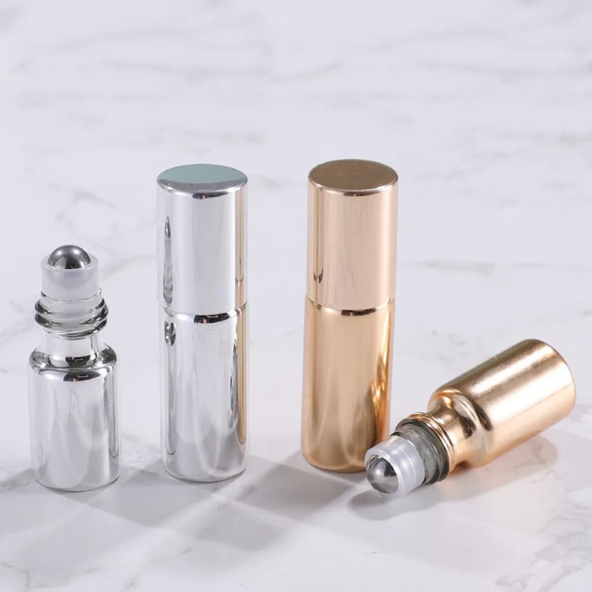 Bouteilles à roulettes en verre or/argent