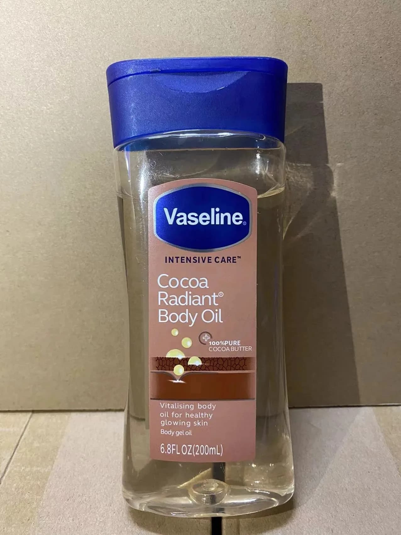 Huile Corporelle Éclatante au Cacao Vaseline 200ml – Soin Hydratant Longue Durée, Huile de Soin Corporel Éclaircissante Anti-Dessèchement, Produit Essentiel pour la Peau