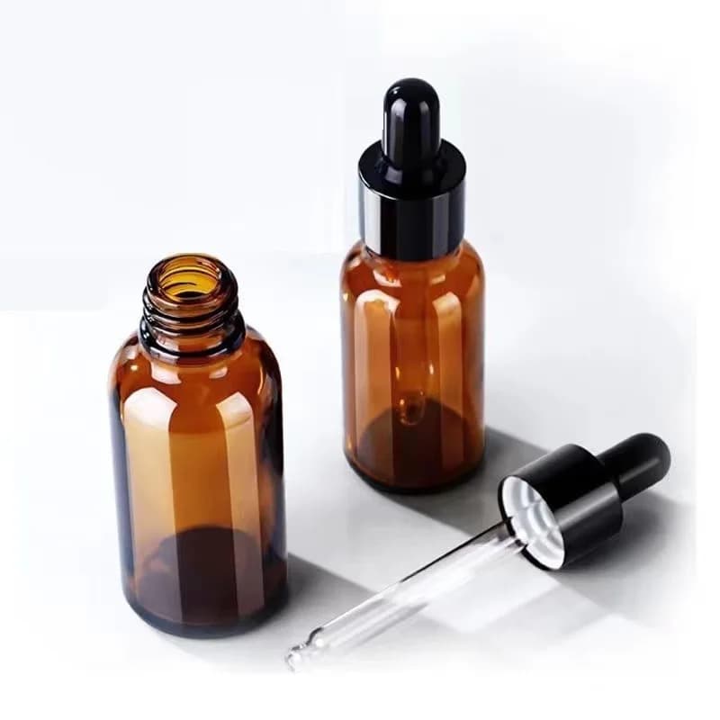 Flacon compte-gouttes vide en verre d'huile essentielle ambre