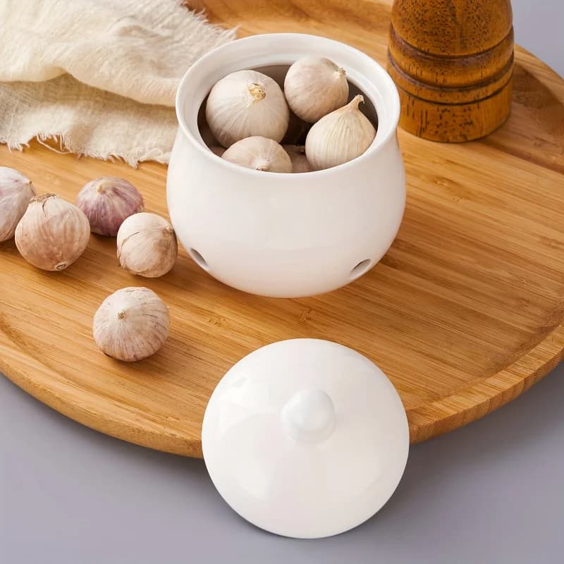 Un ensemble de pots de rangement en céramique pour l'ail et le gingembre, boîtes de rangement modernes creuses pour l'ail