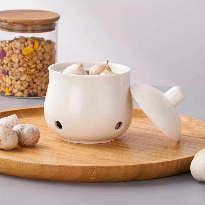 Un ensemble de pots de rangement en céramique pour l'ail et le gingembre, boîtes de rangement modernes creuses pour l'ail