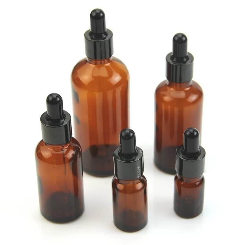 Flacon compte-gouttes vide en verre d'huile essentielle ambre
